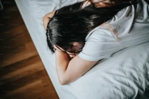 Woman sleeping comfortably after creating a safe space with the help of a Manhattan therapist.