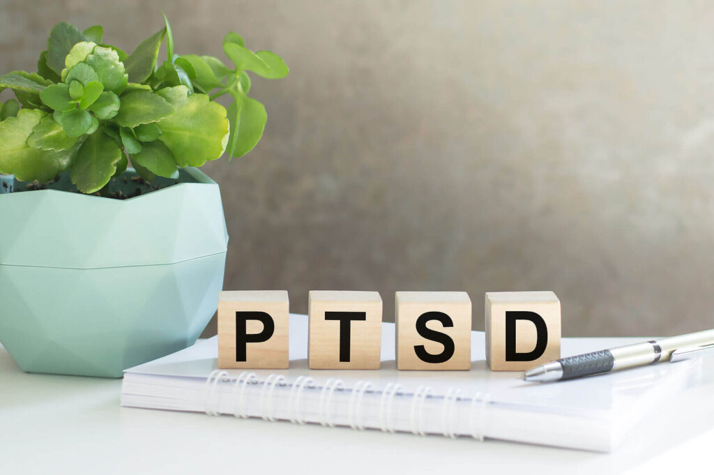 Image of PTSD written out on 4 wooden blocks. Showing that PTSD can be helped with anxiety therapy in Manhattan, NY. Along with PTSD you can also get treatment for social anxiety with a therapist in Manhattan or Brooklyn.