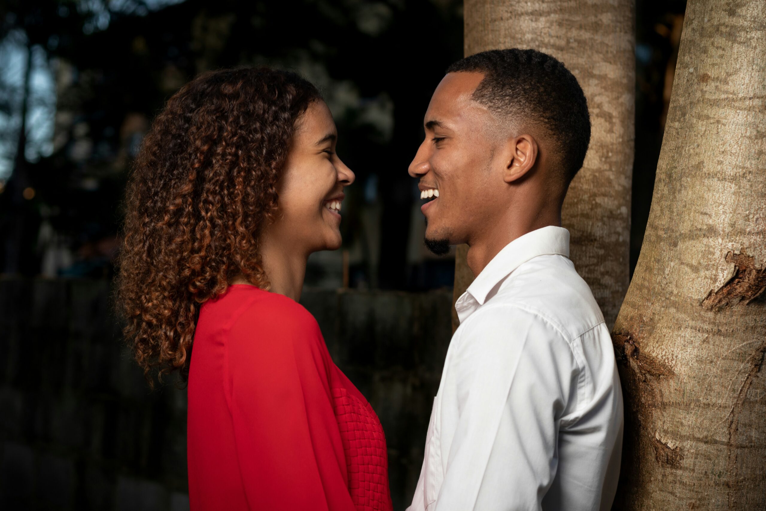 Black man and woman, looking at each other with love and smiles in Manhattan. Sexual attraction can grow in the right relationships.