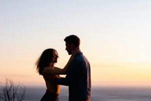 Couple standing in front of a sun set in Manhattan. Values do matter in a relationship. Make sure yours aligns with your partner today.