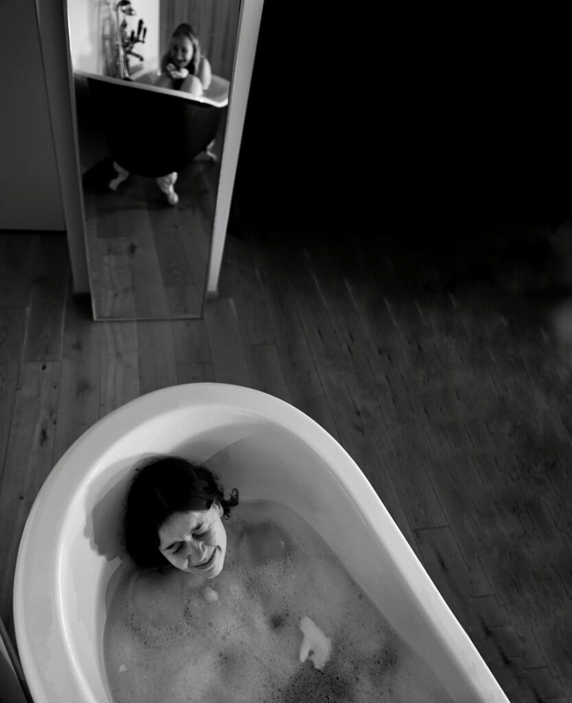 Brooklyn woman crying in a bathtub. Do you know the difference between sadness and depression? Therapy in Brooklyn can help you.  