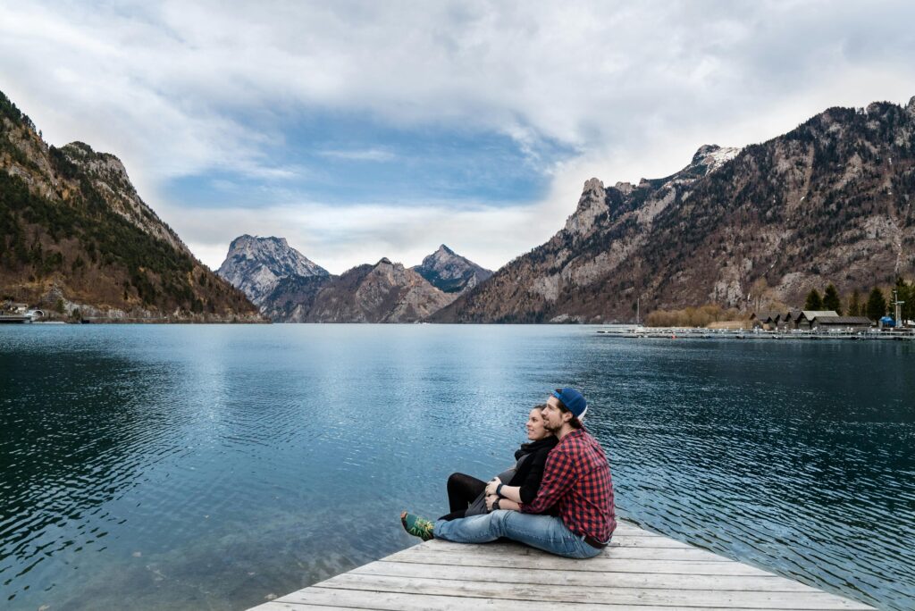 Brooklyn man and woman sitting by a lake reflecting on their relationship. 