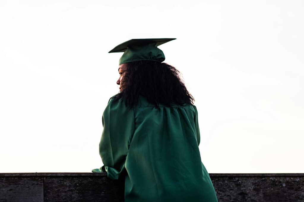 Brooklyn student graduation picture. Academic stress can be hard to navigate, but therapy can help. 