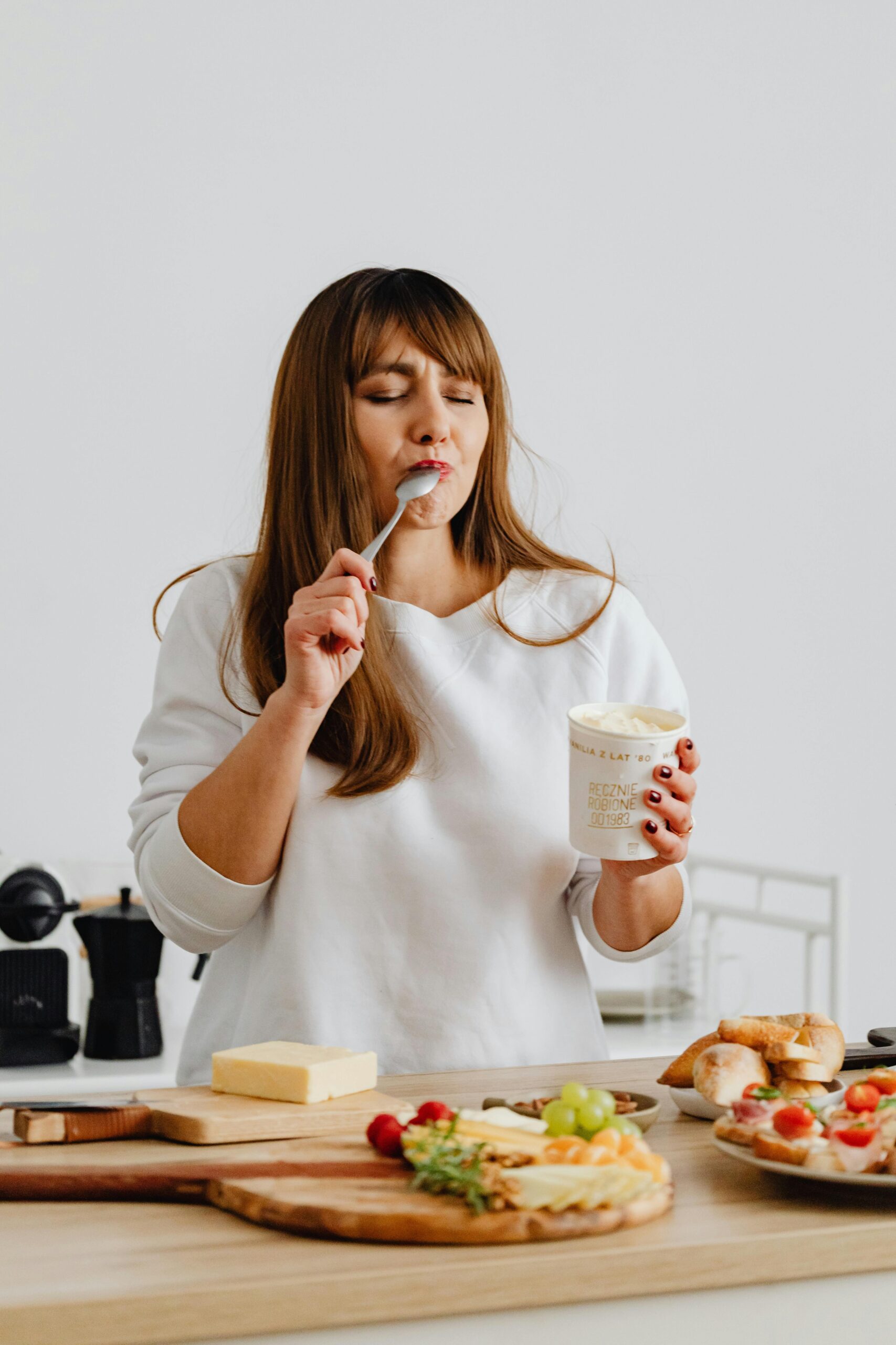 Woman setting up food and eating it.