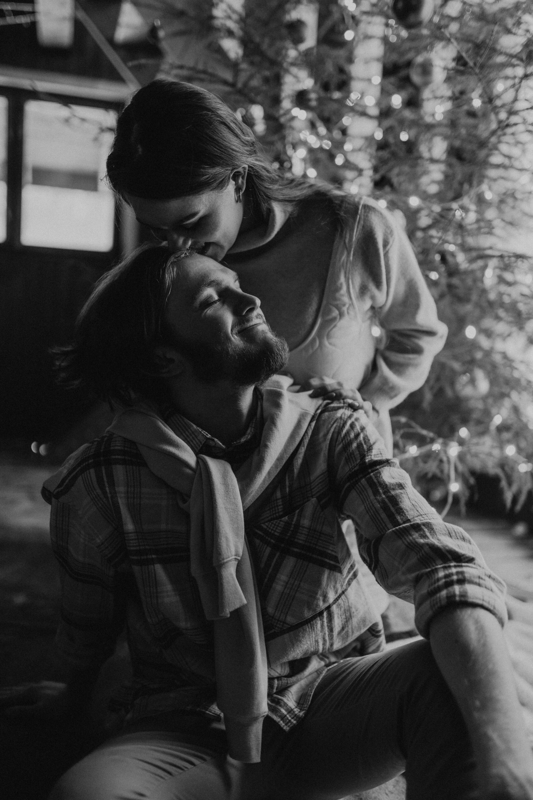 Black and white image of a couple together during the holidays.