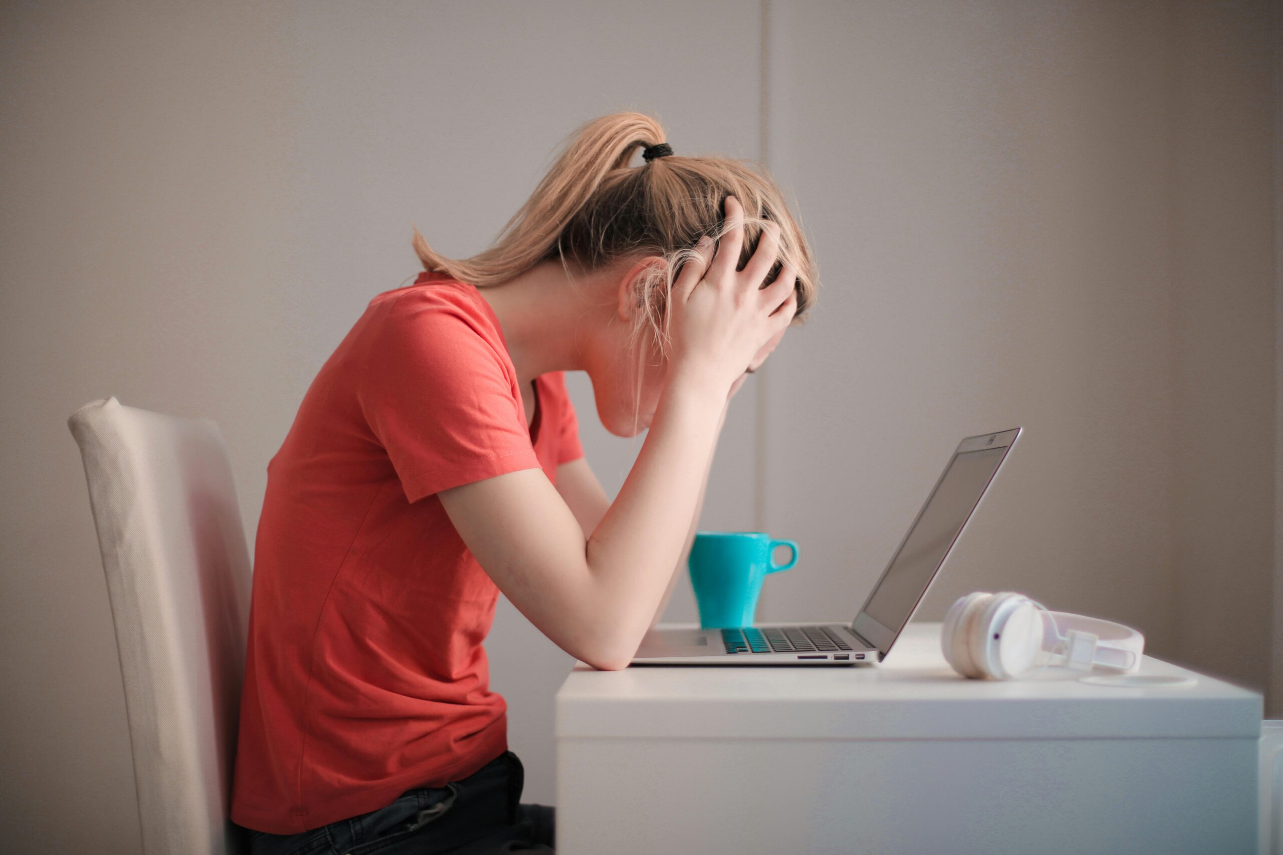 Stressed woman in front of her computer.