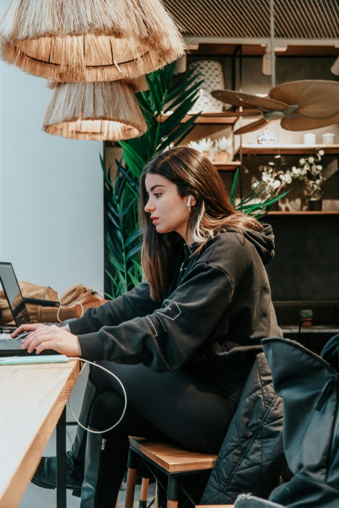 Woman working with her headphones in.