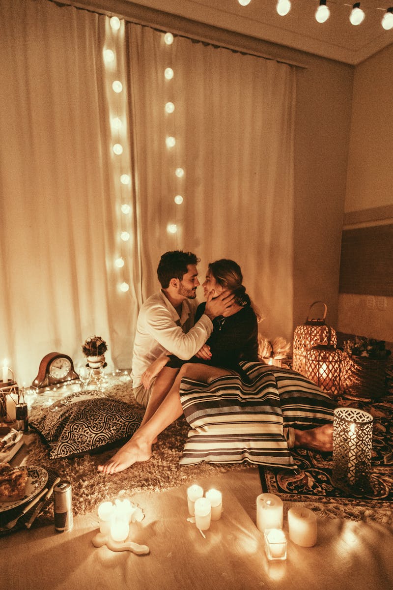 Couple surrounded by lights and candles.