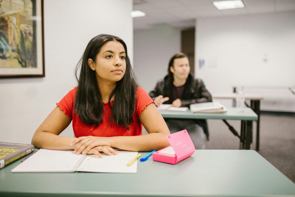 Students at their desks in the classroom.