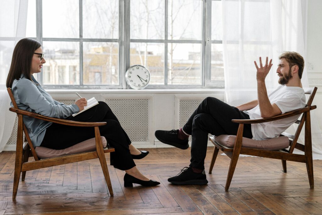 Man and female therapist in session.