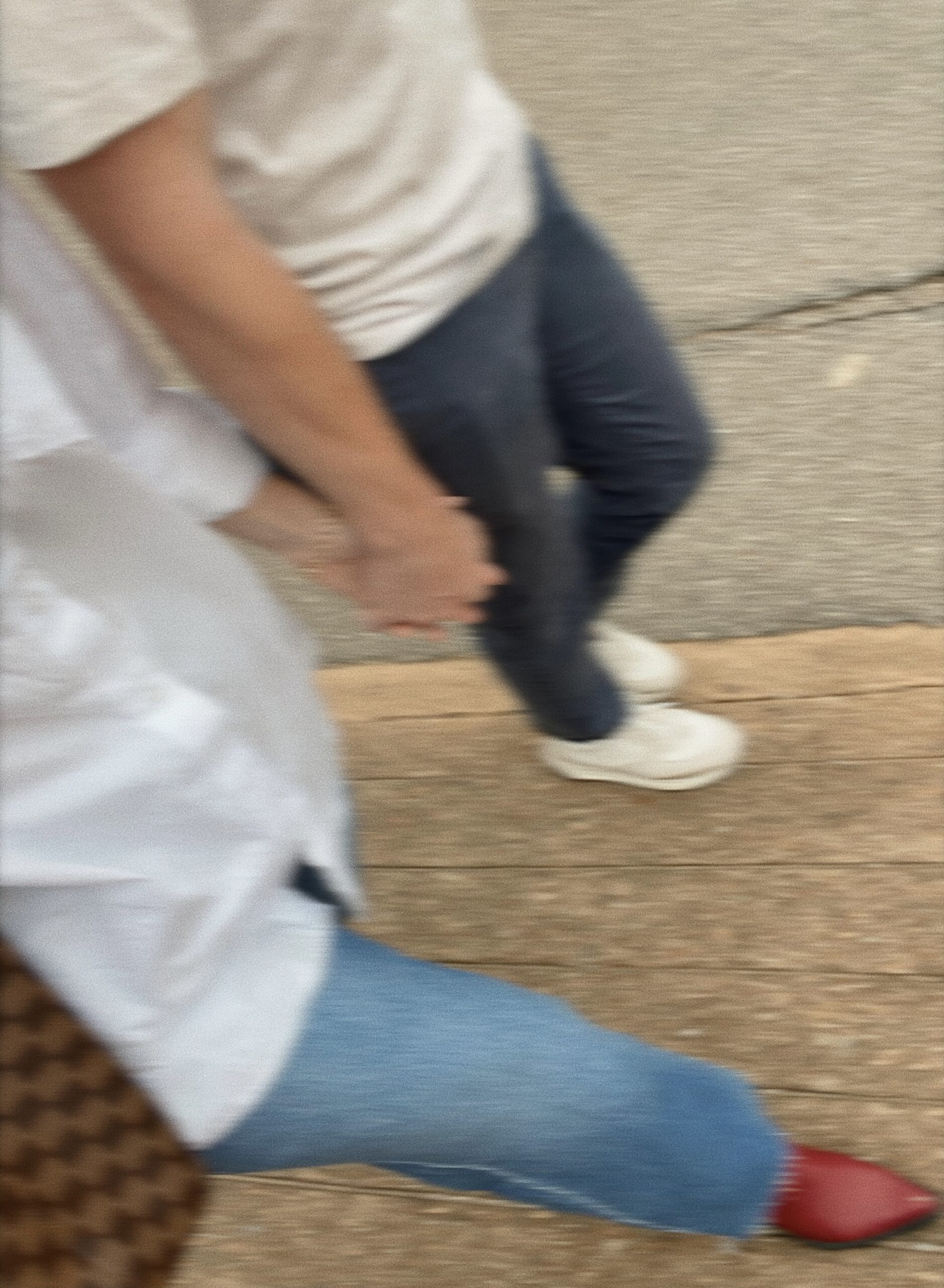 Couple holding hands and walking.