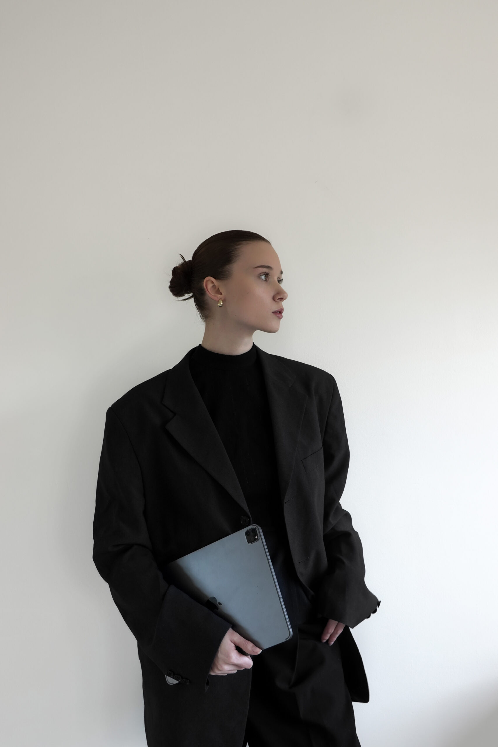 Confident working woman holding her computer.