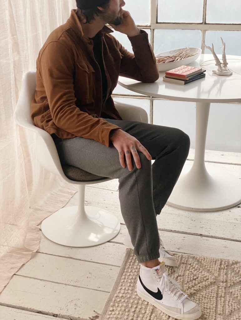 Man sitting thinking at a table.