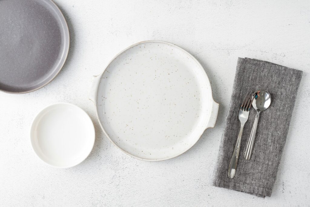 Table setting with empty plate.