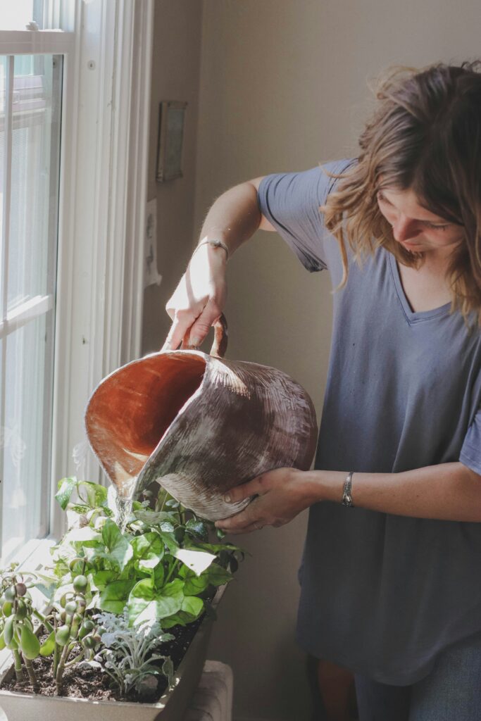Woman watering her plants.