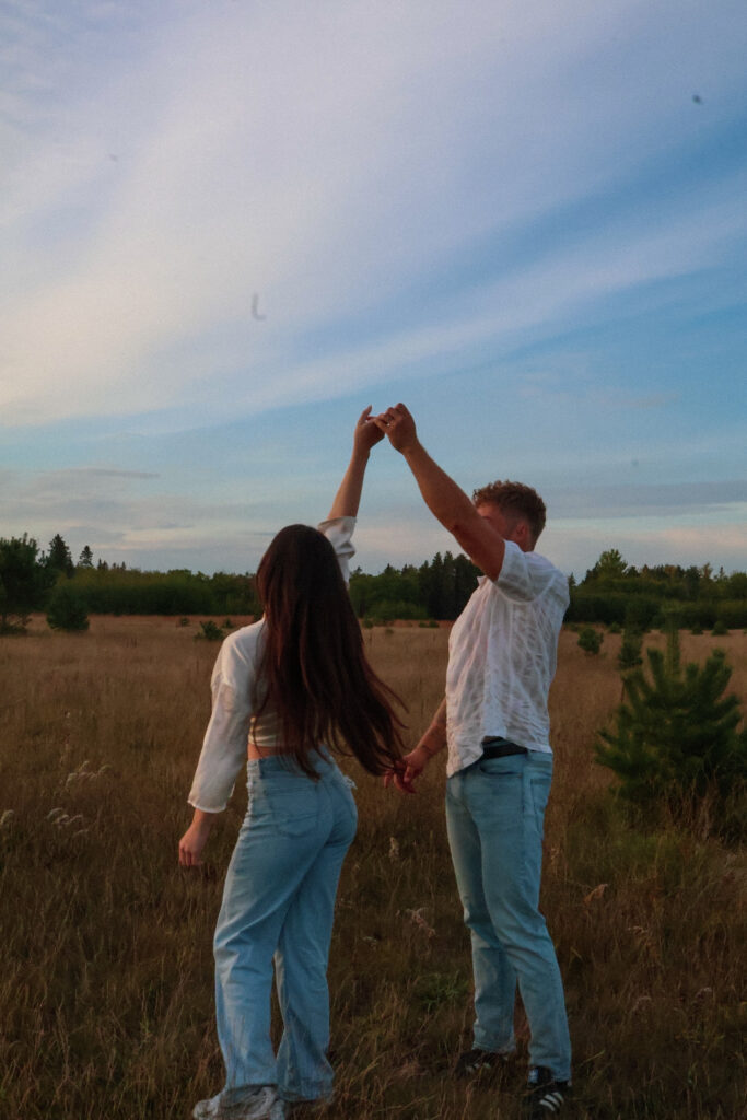 Couple dancing in a field.