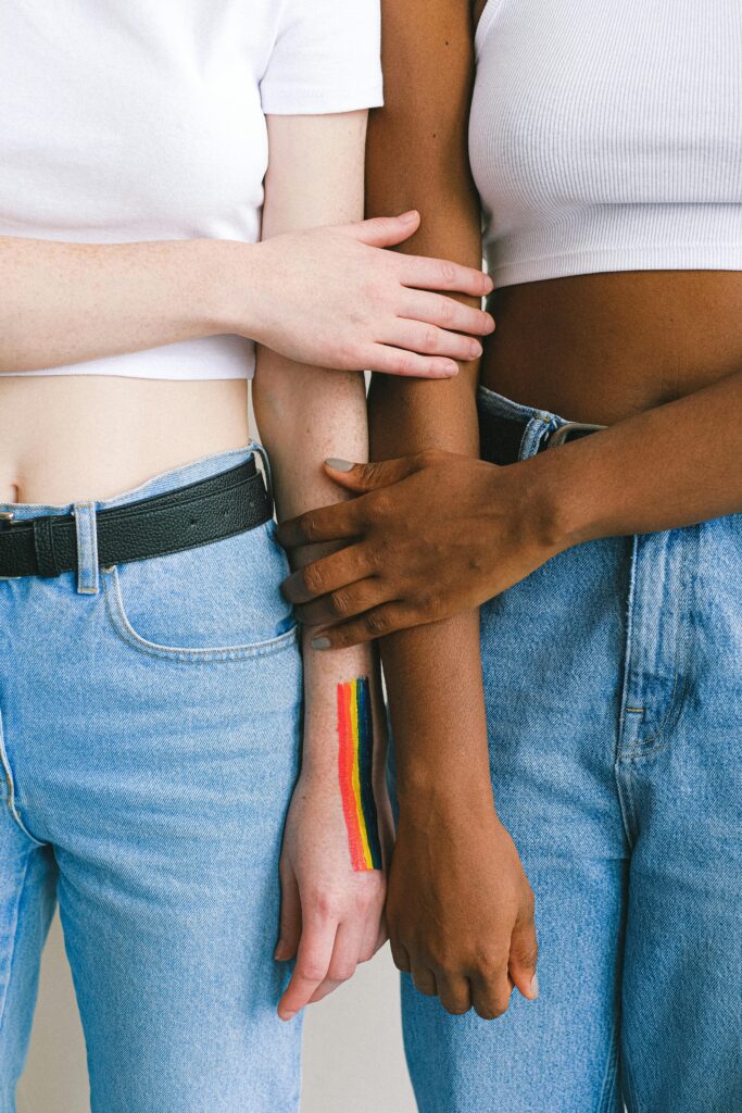 LGBTQ+ couple holding hands.