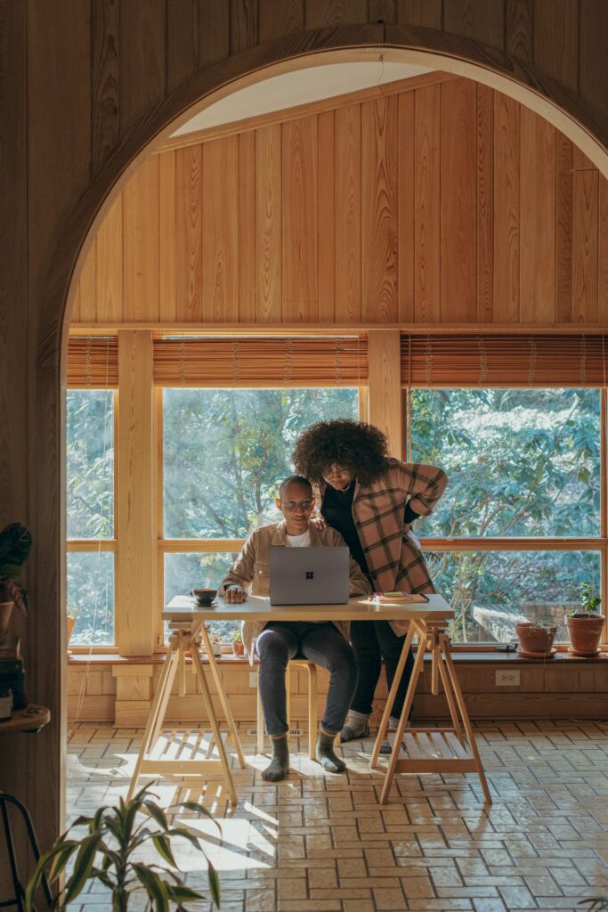 Couple looking at a computer together.