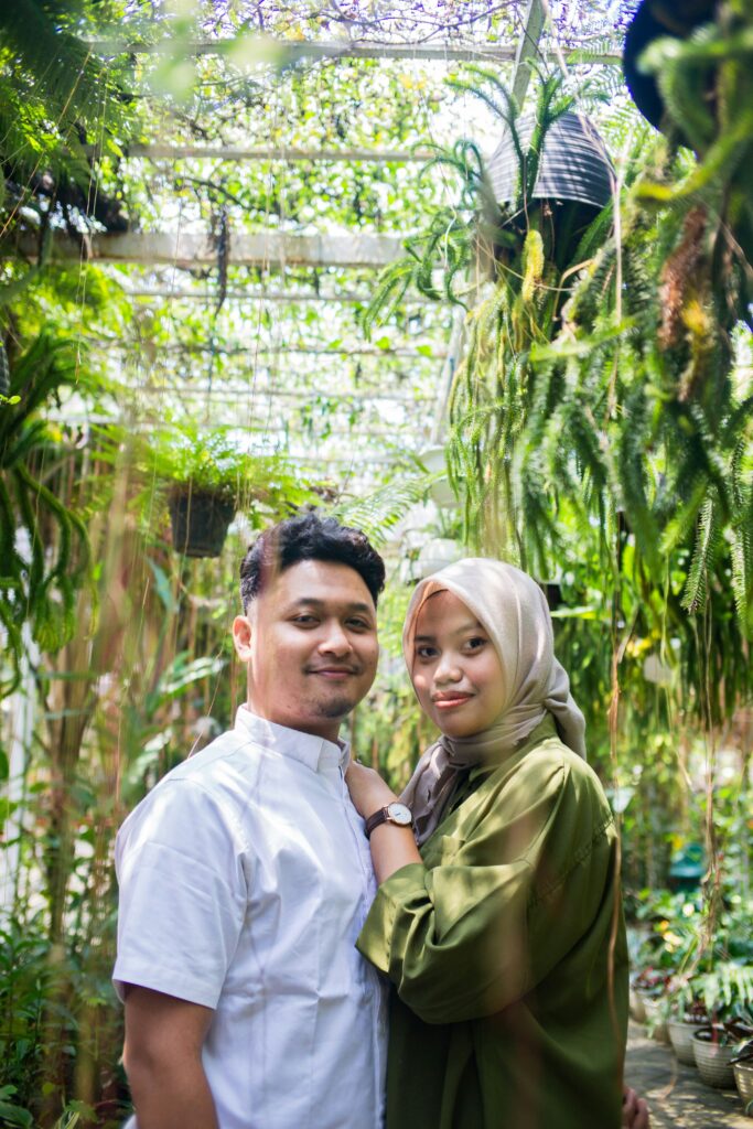 Couple smiling at the camera together.