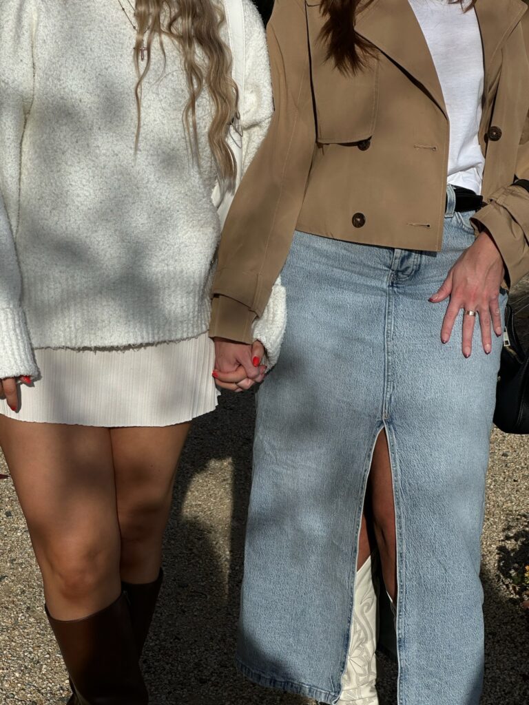 Two friends holding hands.