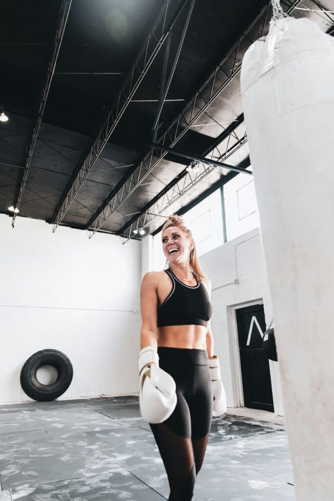 Woman happy while boxing.