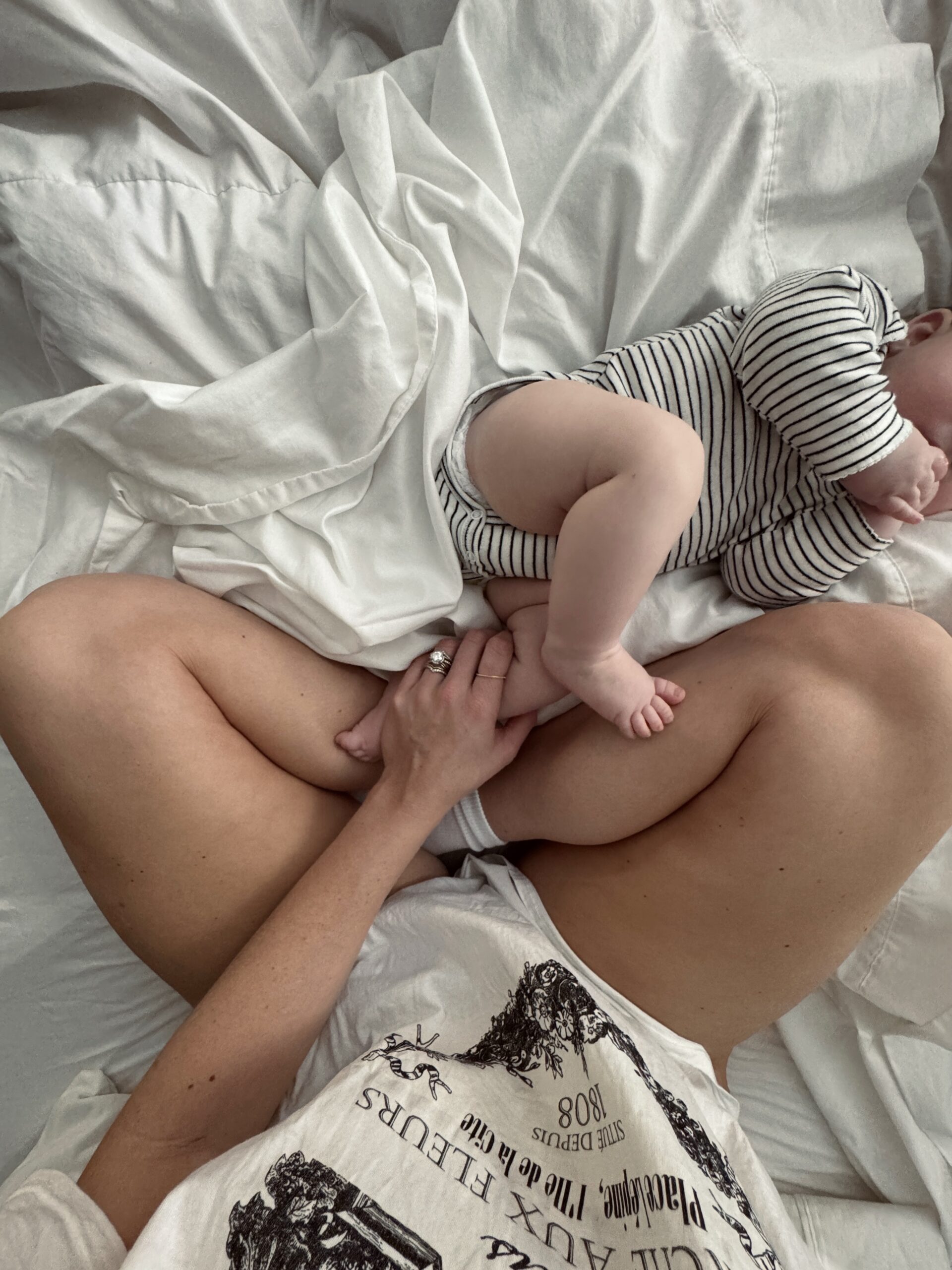 mom with baby on the bed
