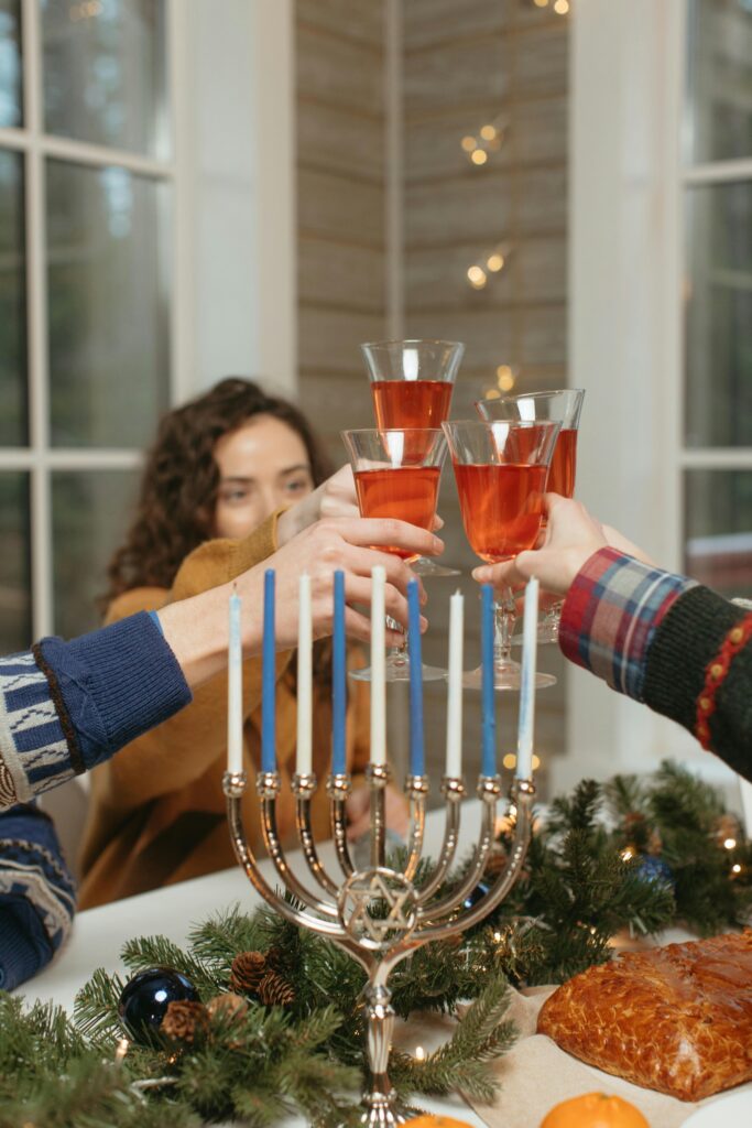 Family cheersing drinks during Hannukah.