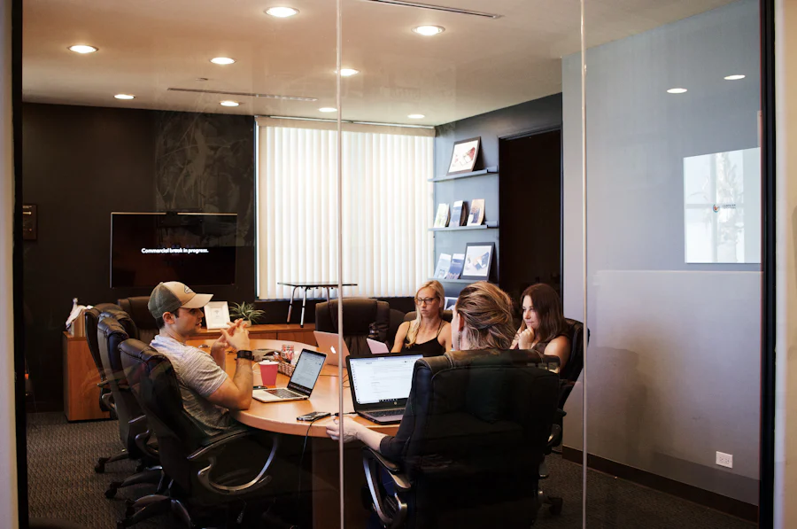 a group of people in a meeting room discussing