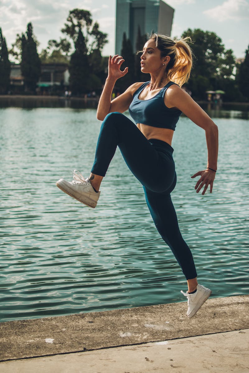 Woman doing workouts by the water