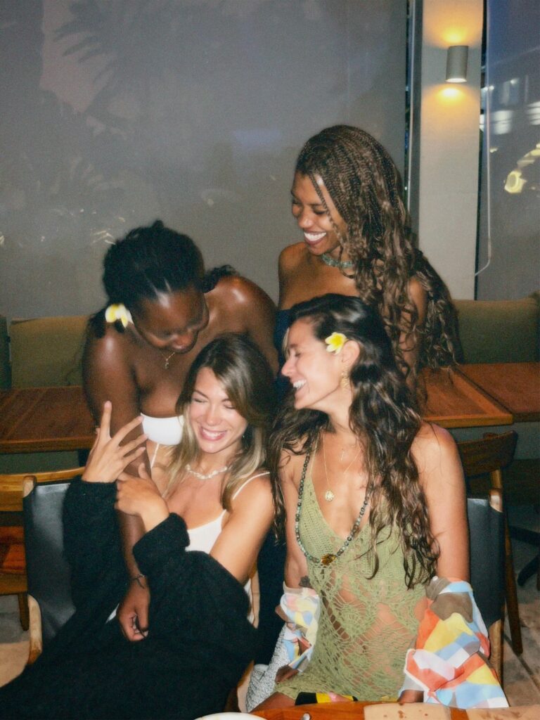 Four girls smiling and bonding on Valentine's Day in Brooklyn