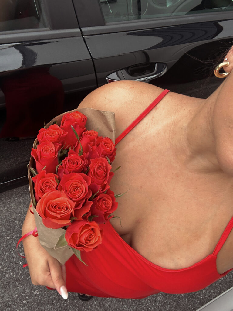 Single girl holding her red flowers during Valentine's Day