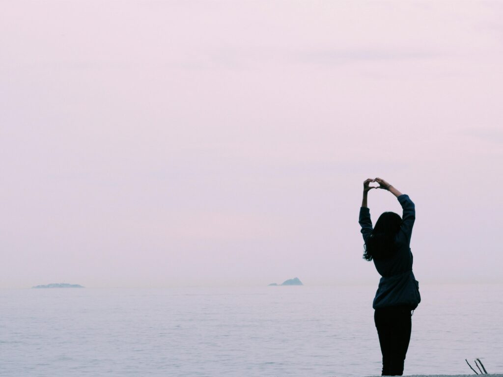 Woman holding her hand up in a heart-shaped in Brooklyn