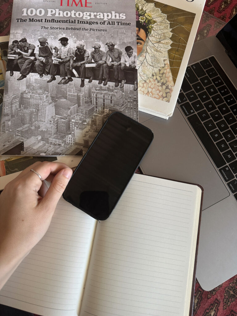A person taking a rest on scrolling through social media and decided to write on her journal in Brooklyn
