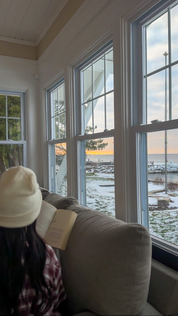 Girl reading about mental health therapy and sitting on a couch in Manhattan 