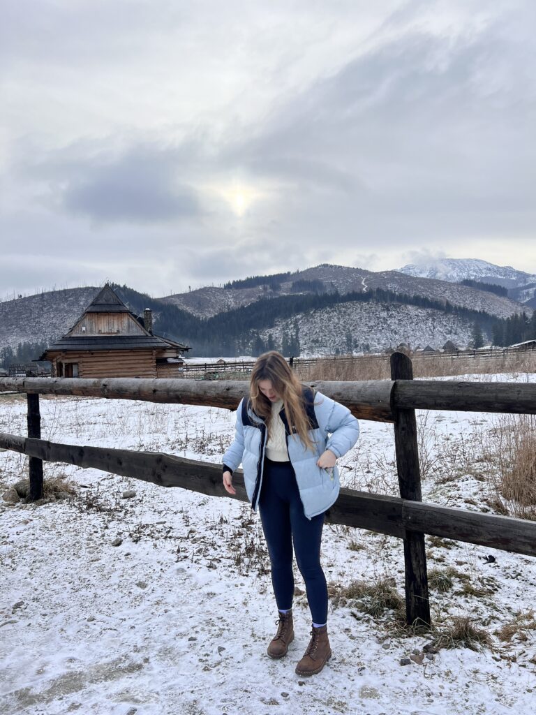 Woman standing outside planning to take a walk on the snow at New York 