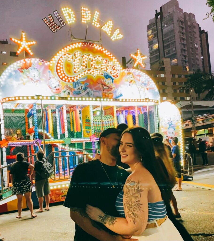 An example of a perfect couple happy and steady while in a circus at Brooklyn
