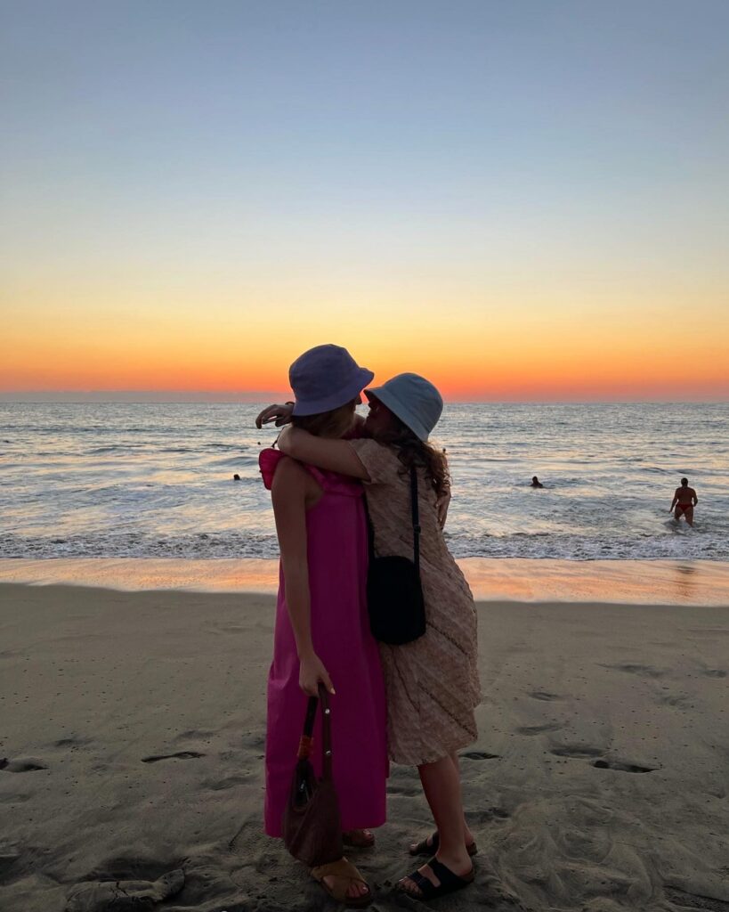 Couple embracing freely without any judgement while watching sunset at Manhattan