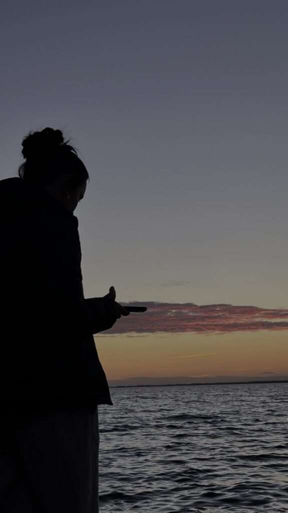 Woman scrolling through her phone anxiously waiting for a reply at Manhattan