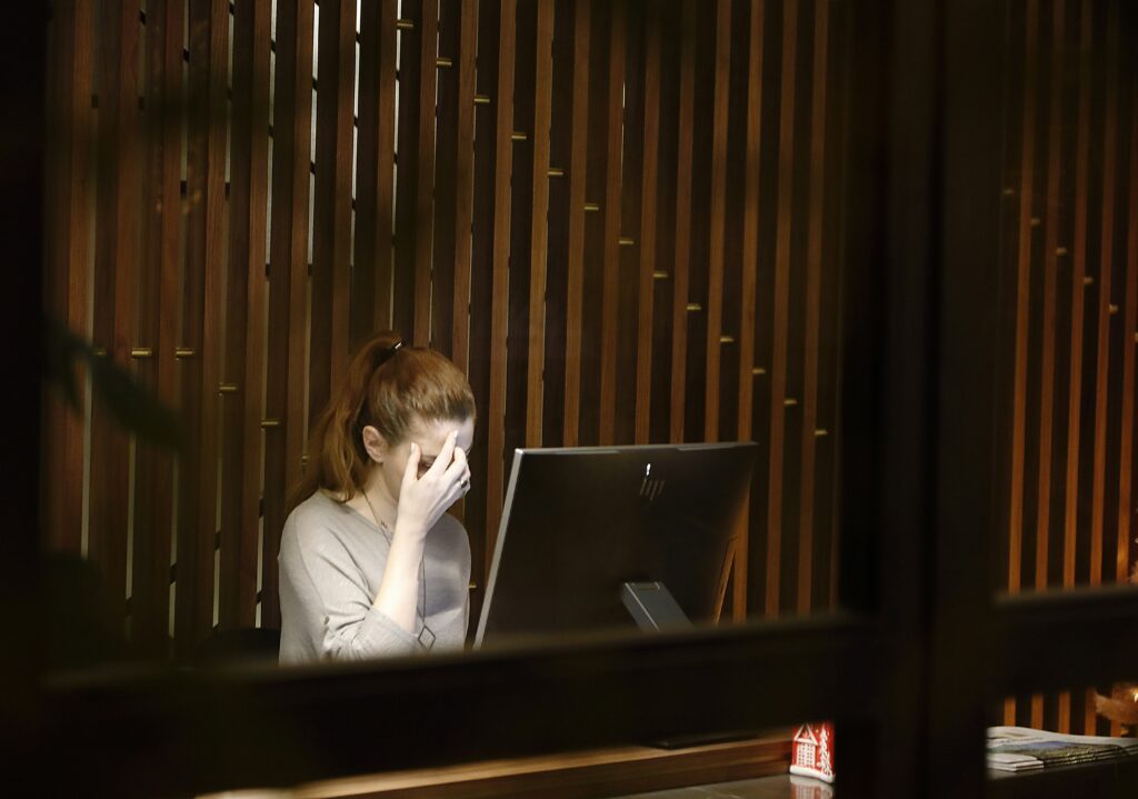 Woman getting stress because of workload at the office in New York