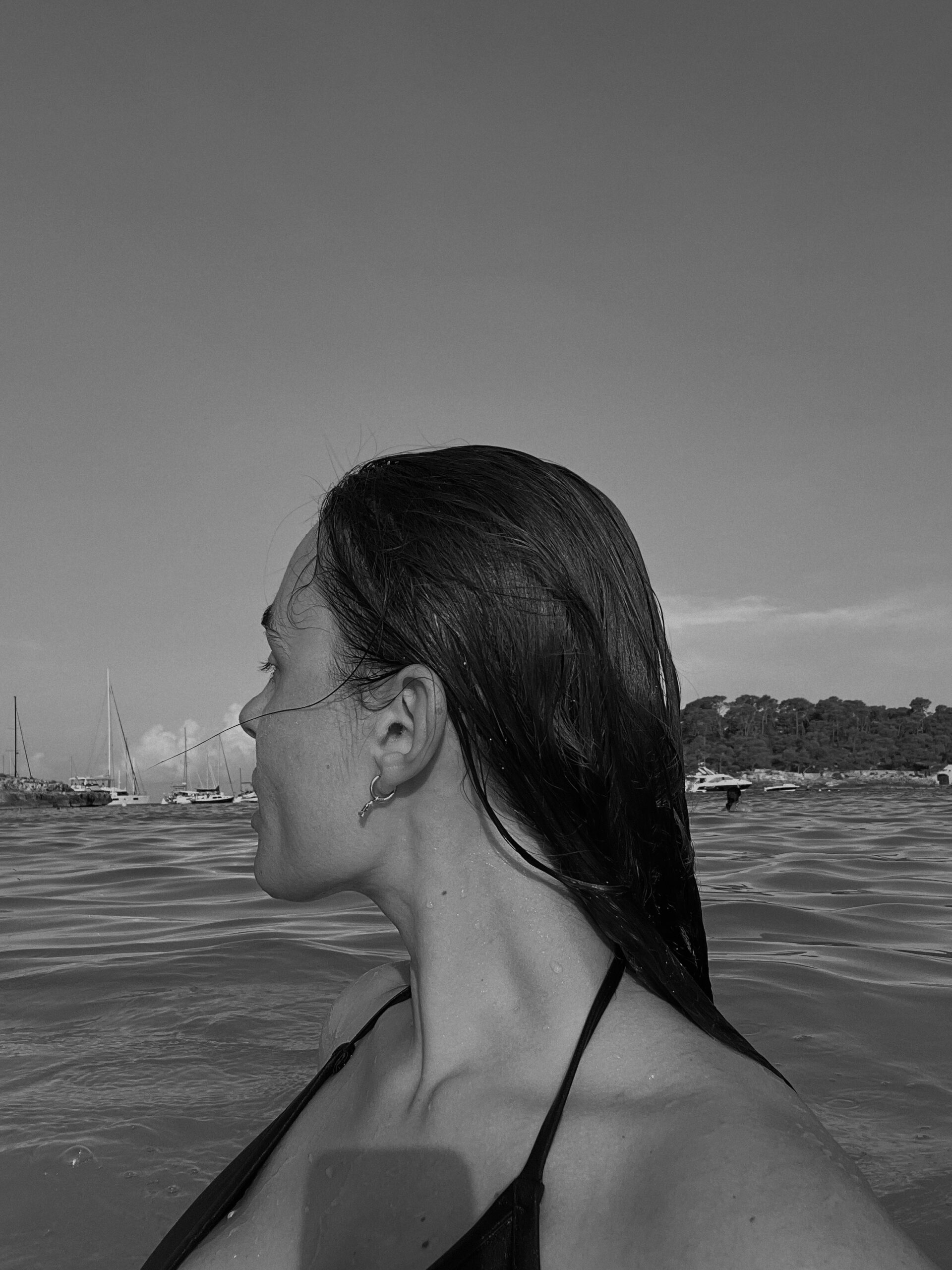 Woman swimming at the beach to reduce stress at Manhattan