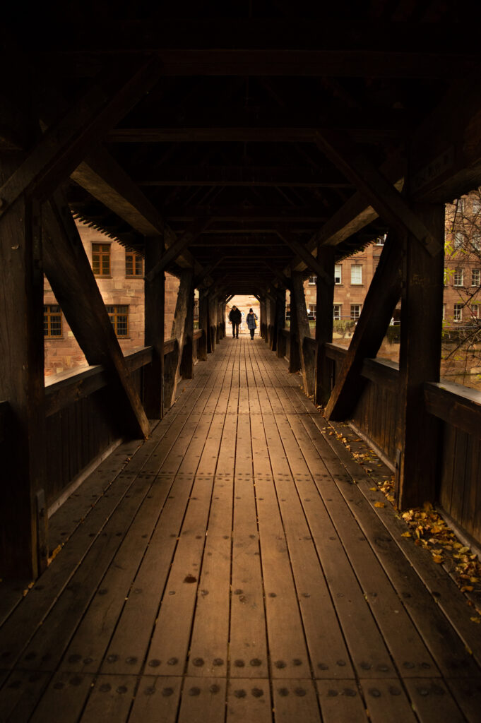 Couple walking at the bridge trying to communicate properly after a fight at New York