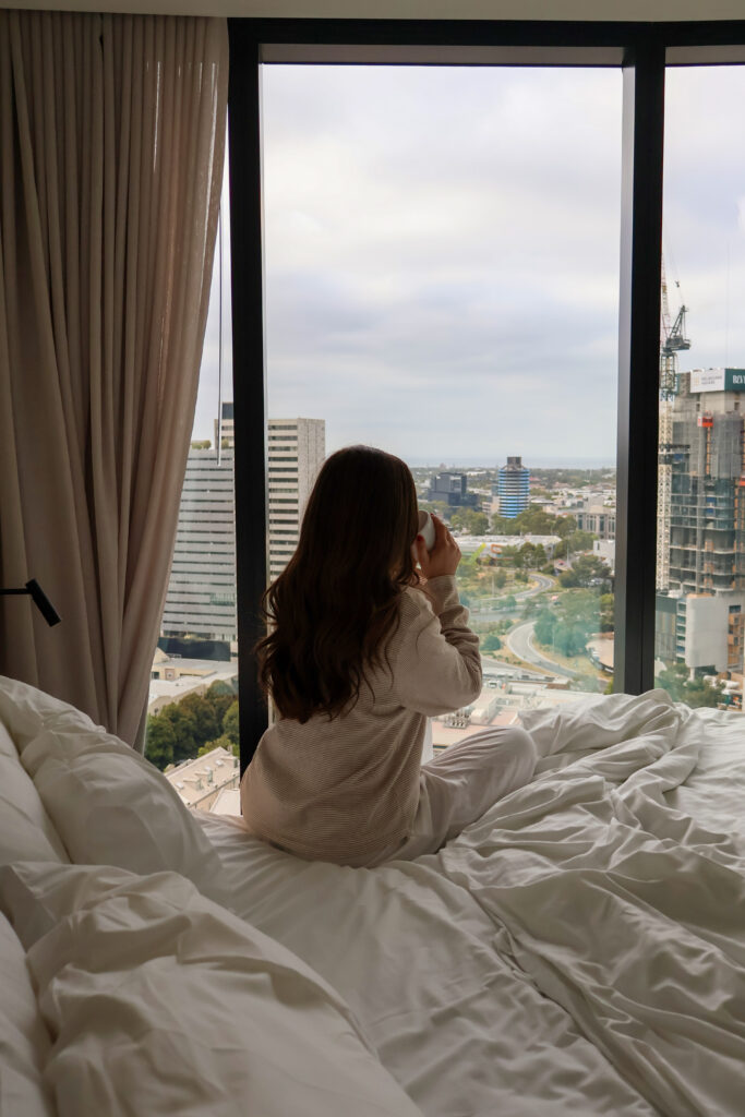 Woman taking care of self and reflecting on thoughts at her home in Brooklyn