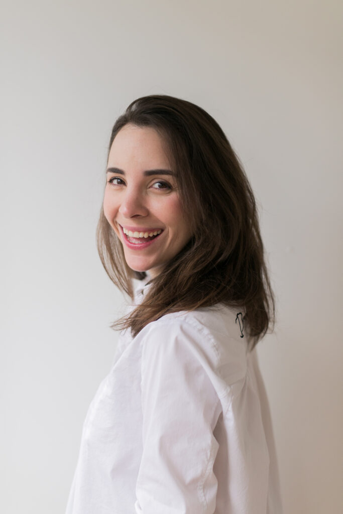 Woman smiling and choosing self-trust over self-surveillance at New York