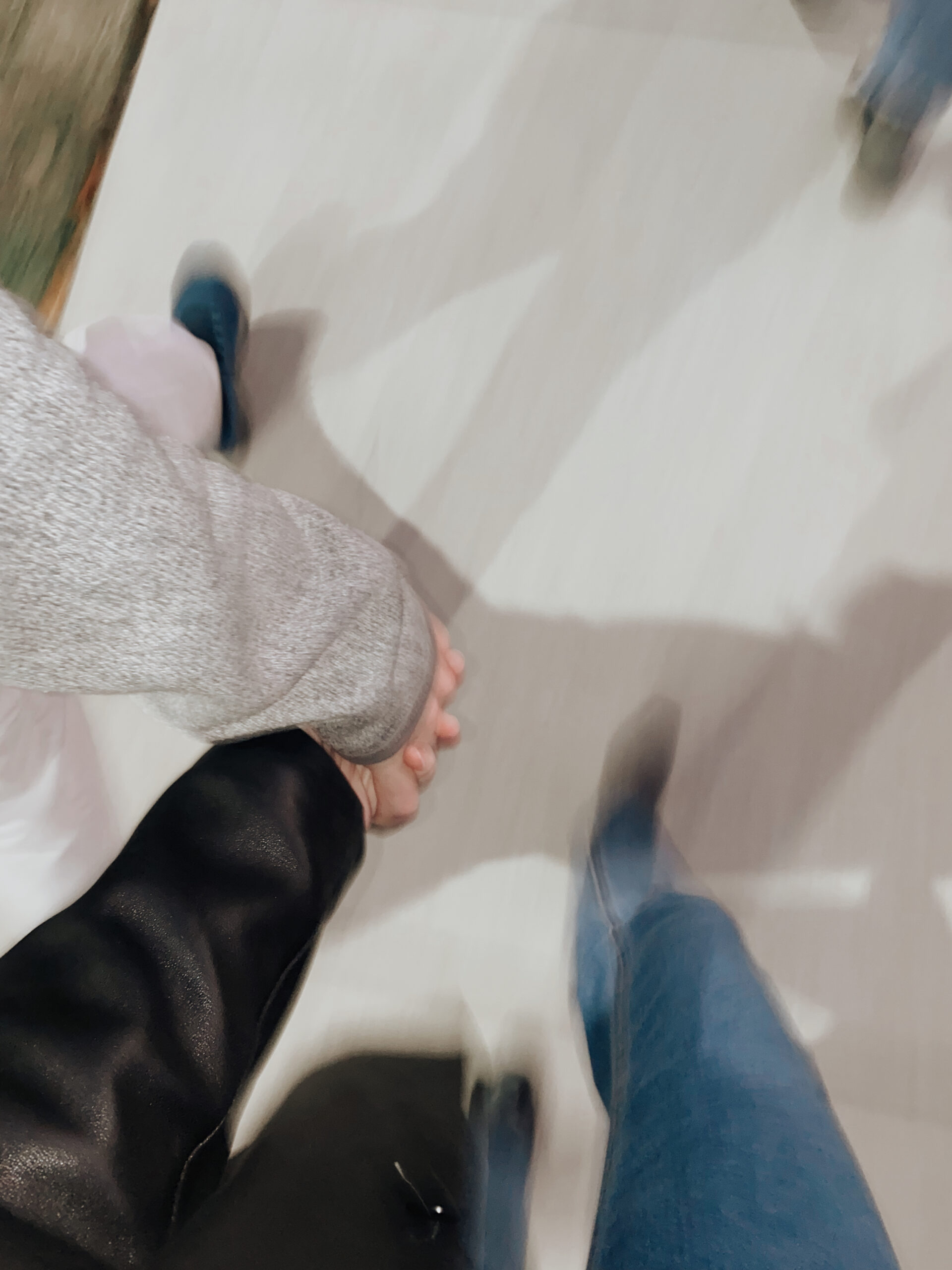 Blurry photo of a couple holding hands in Brooklyn