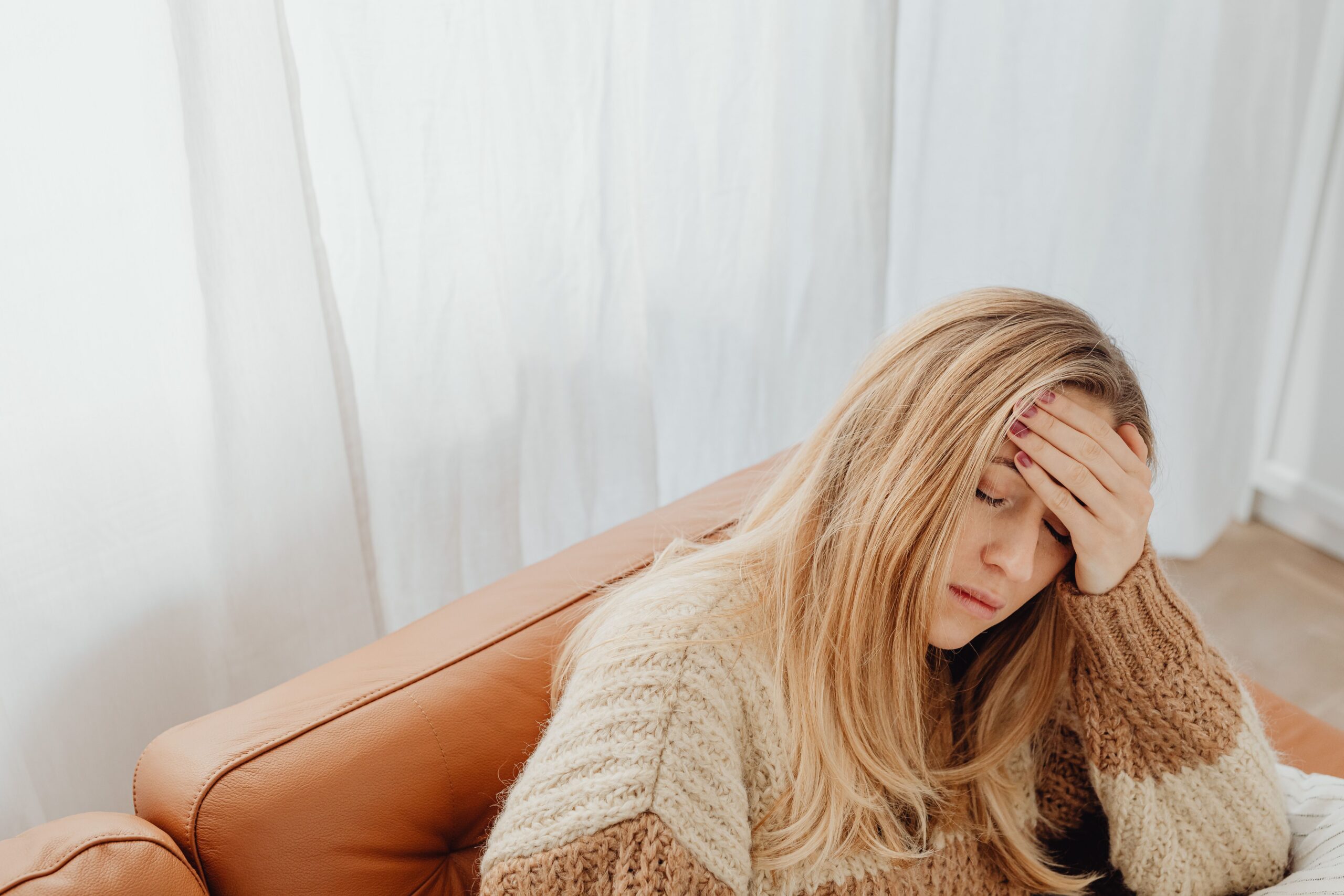 Woman having a headache due to so much stress at Manhattan