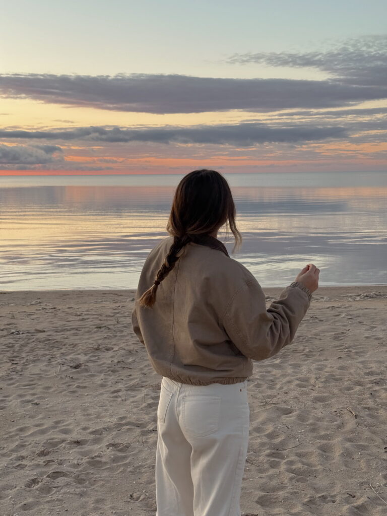 Girl trying to slow down on summer plans and just enjoying the scenery of the beach at New York
