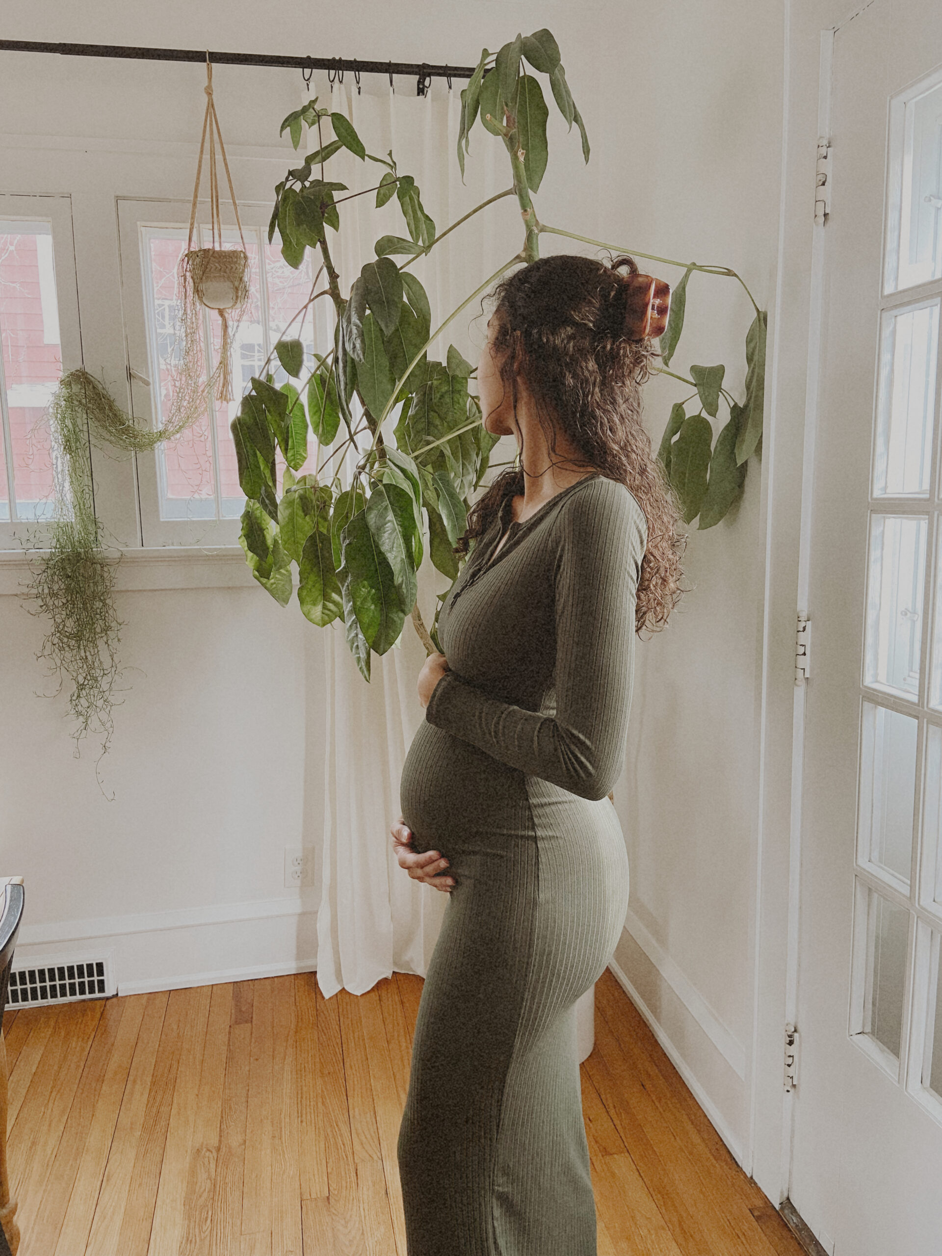Mother feeling her baby bump at Manhattan