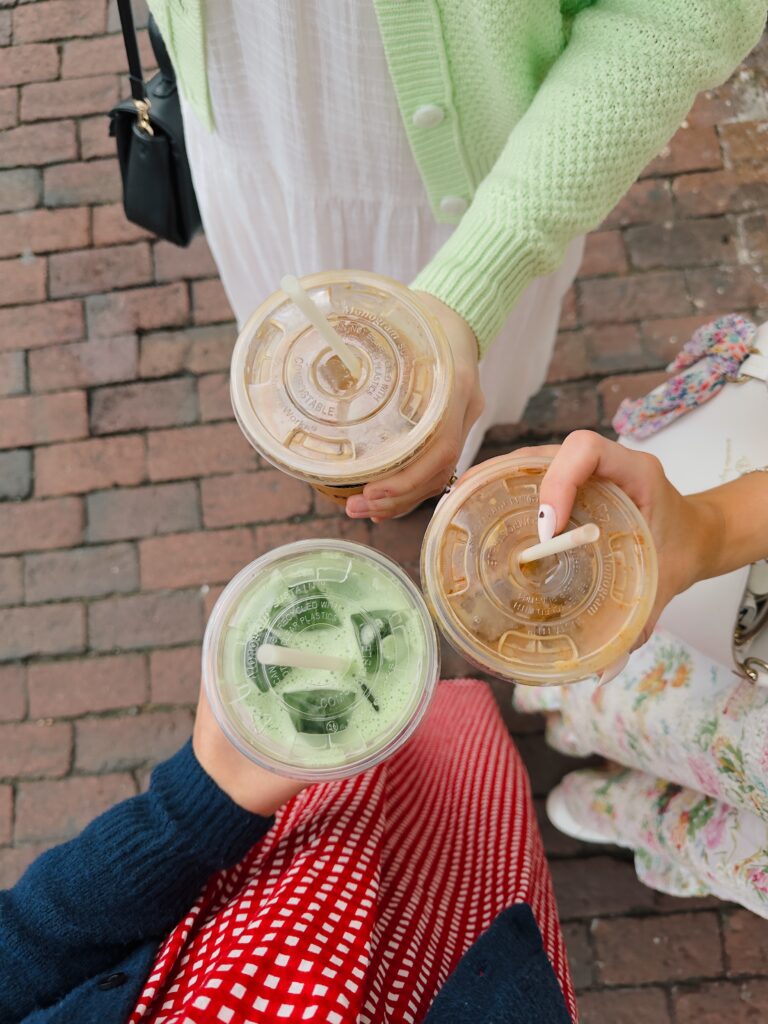 Friends enjoying and having a fun time together drinking coffee at New York