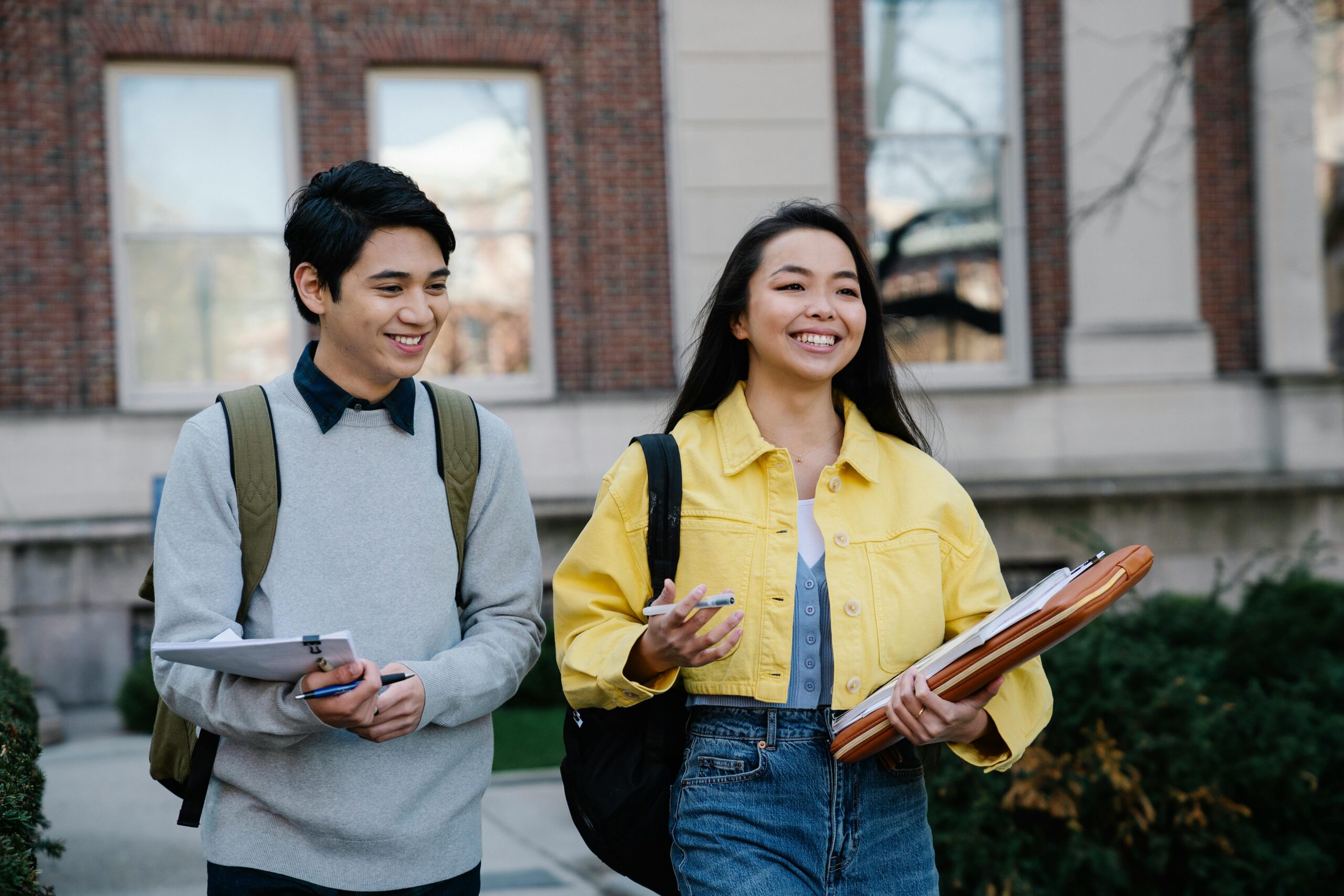 College students walking happily at their campus at New York