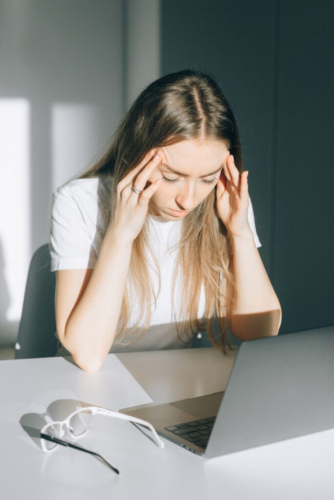 Girl stressed and feeling the anxiety creeping up while working at Brooklyn